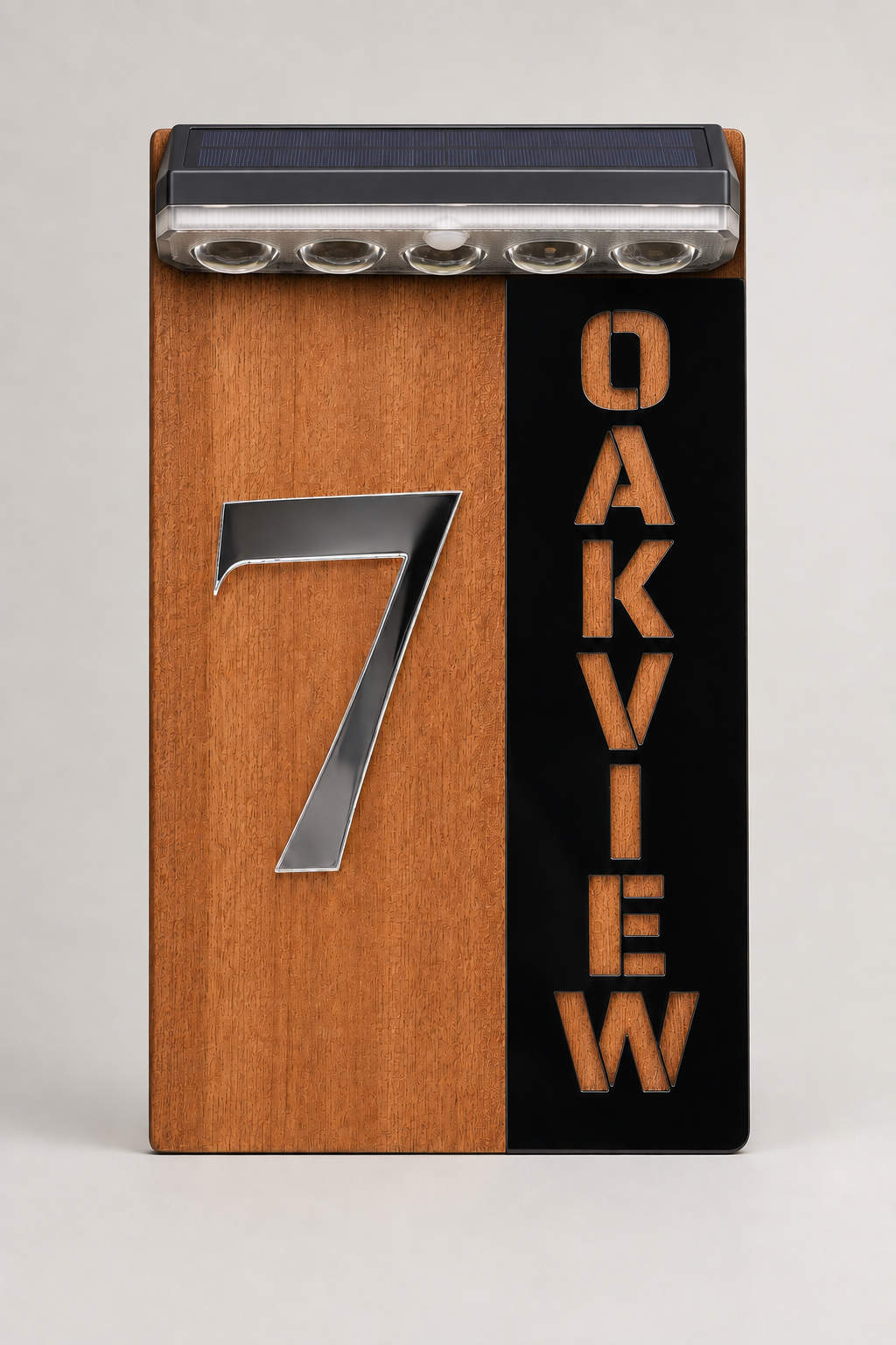 A vertical Oakview tablet with a split wood-grain and black front panel, featuring a large silver number 7 on the left and the word OAKVIEW in orange on the right. A solar panel is visible along the top edge. Lumora Craft Studio